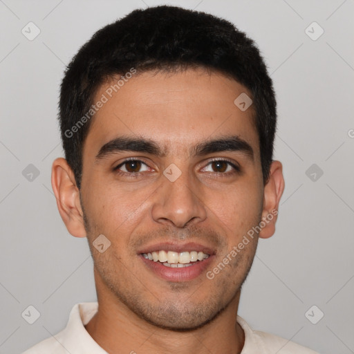 Joyful latino young-adult male with short  brown hair and brown eyes