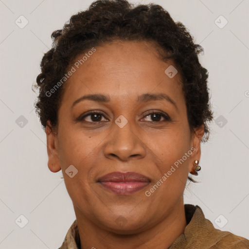 Joyful black adult female with short  brown hair and brown eyes