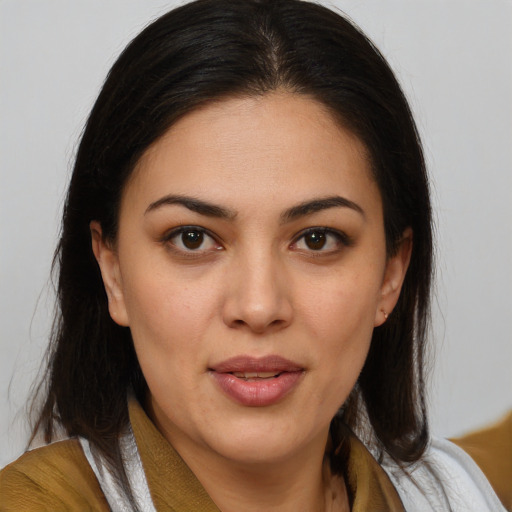 Joyful latino young-adult female with medium  brown hair and brown eyes