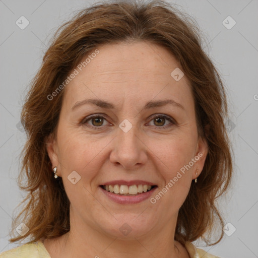 Joyful white adult female with medium  brown hair and brown eyes