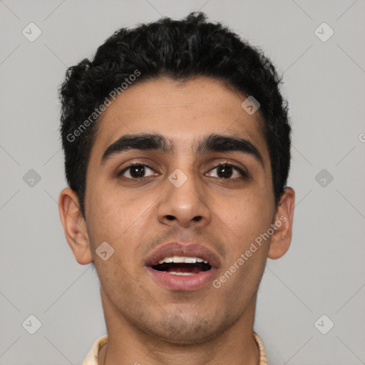 Joyful latino young-adult male with short  black hair and brown eyes