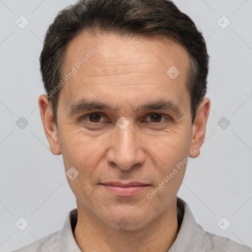 Joyful white adult male with short  brown hair and brown eyes