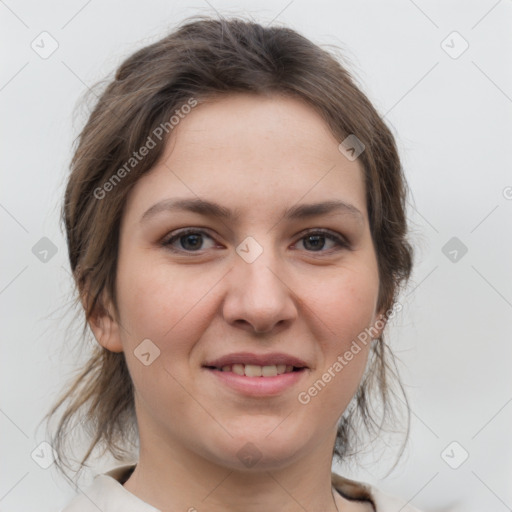 Joyful white young-adult female with medium  brown hair and grey eyes