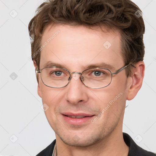 Joyful white adult male with short  brown hair and grey eyes