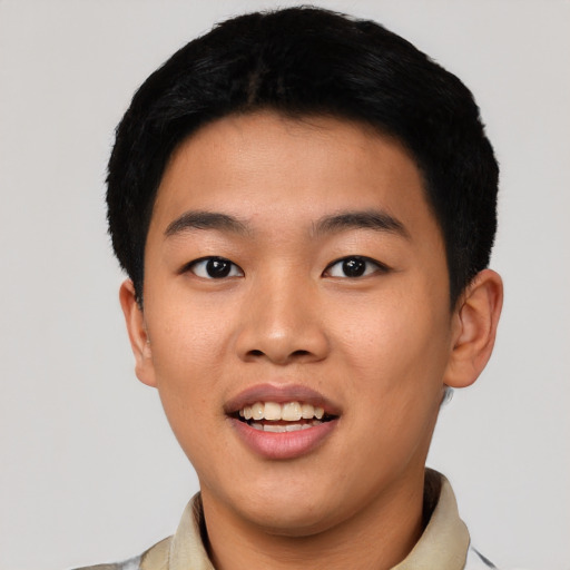 Joyful asian young-adult male with short  black hair and brown eyes