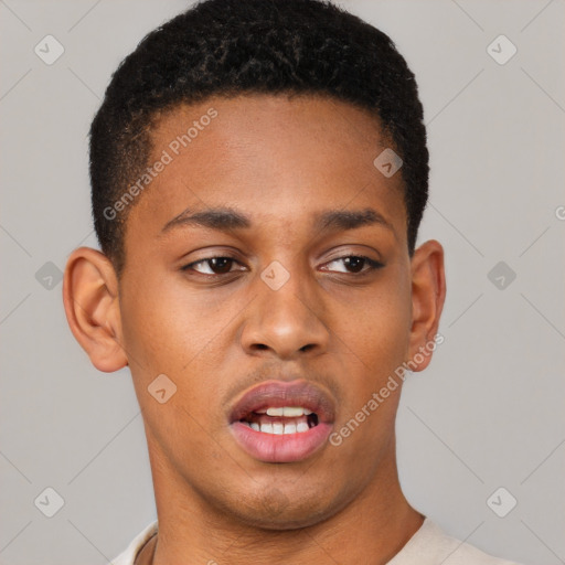 Joyful latino young-adult male with short  brown hair and brown eyes