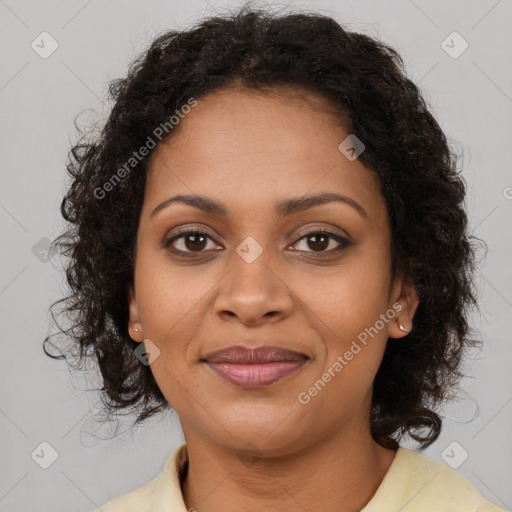 Joyful black young-adult female with long  brown hair and brown eyes