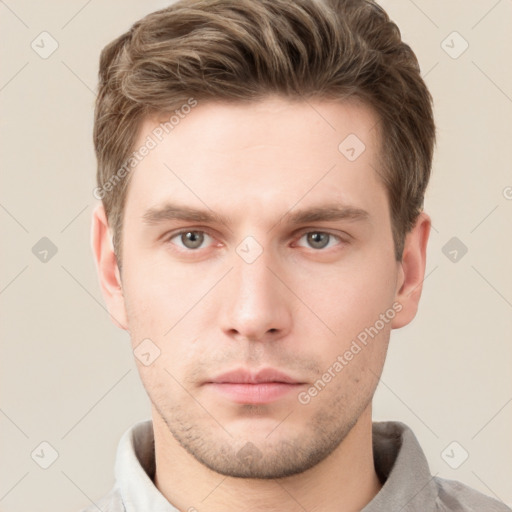 Neutral white young-adult male with short  brown hair and grey eyes