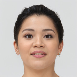 Joyful asian young-adult female with short  brown hair and brown eyes