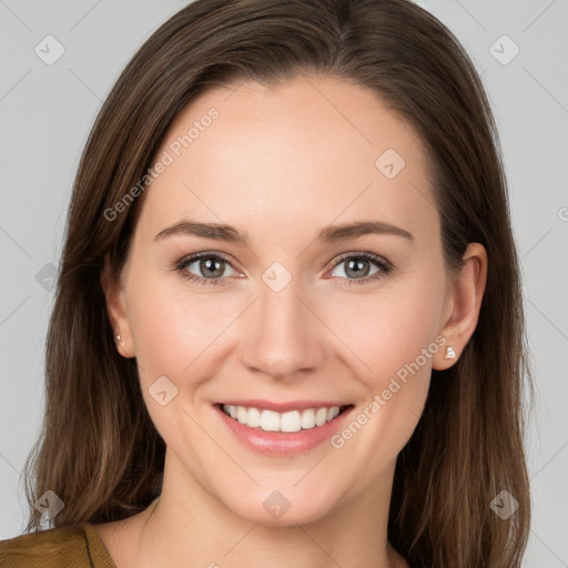 Joyful white young-adult female with long  brown hair and grey eyes