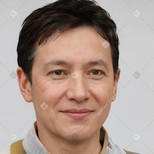 Joyful white adult male with short  brown hair and grey eyes