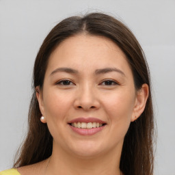 Joyful white young-adult female with medium  brown hair and brown eyes