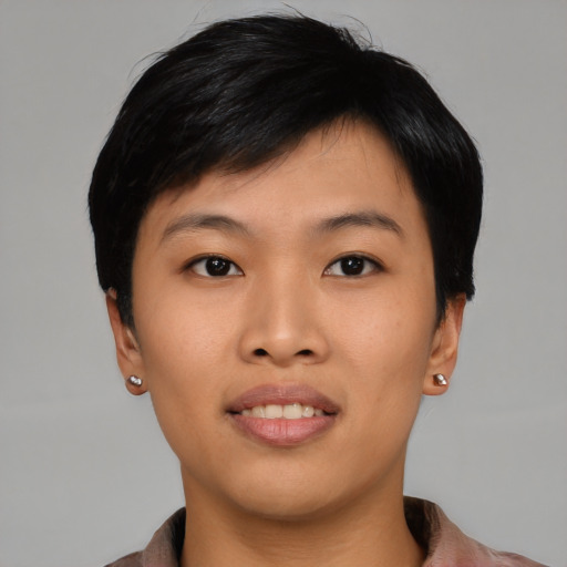 Joyful asian young-adult female with short  black hair and brown eyes