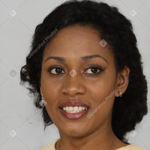 Joyful black adult female with short  brown hair and brown eyes