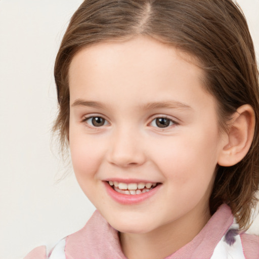 Joyful white child female with medium  brown hair and brown eyes