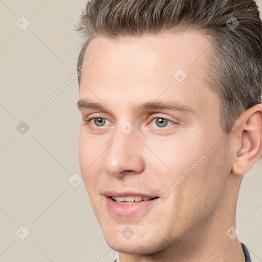 Joyful white young-adult male with short  brown hair and brown eyes