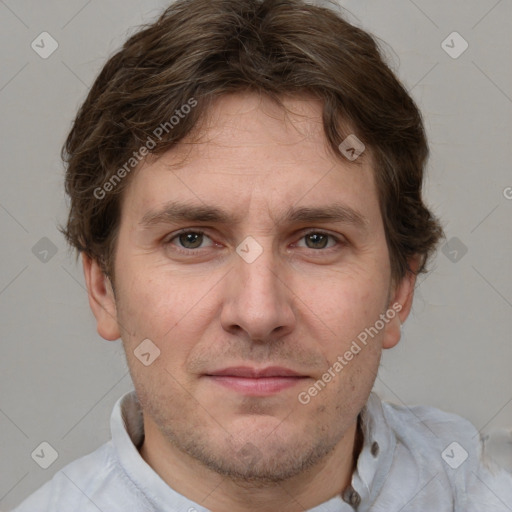 Joyful white adult male with short  brown hair and grey eyes