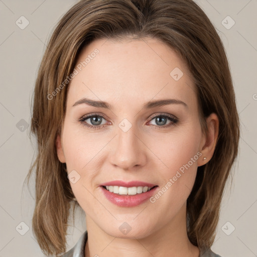 Joyful white young-adult female with medium  brown hair and green eyes