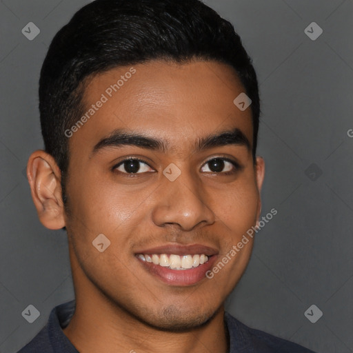 Joyful latino young-adult male with short  brown hair and brown eyes