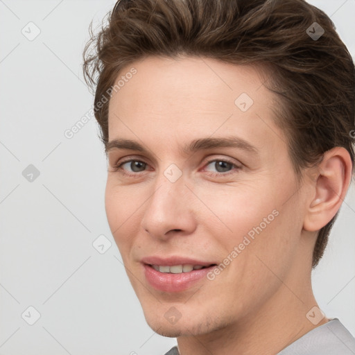 Joyful white young-adult female with short  brown hair and grey eyes