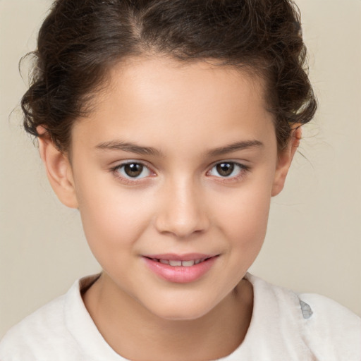 Joyful white child female with short  brown hair and brown eyes