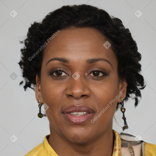 Joyful black adult female with long  brown hair and brown eyes