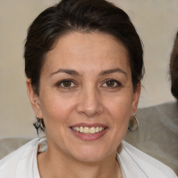 Joyful white adult female with short  brown hair and brown eyes