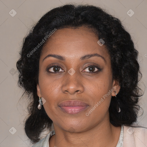 Joyful black adult female with medium  brown hair and brown eyes