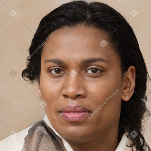 Joyful latino adult female with medium  brown hair and brown eyes