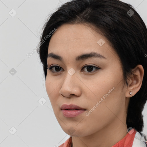 Joyful asian young-adult female with medium  black hair and brown eyes