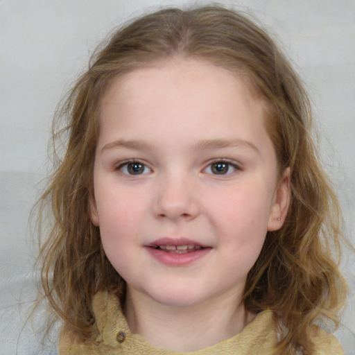 Joyful white child female with medium  brown hair and grey eyes