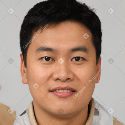 Joyful asian young-adult male with short  brown hair and brown eyes
