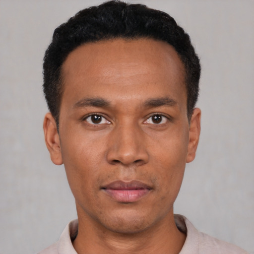 Neutral latino young-adult male with short  black hair and brown eyes