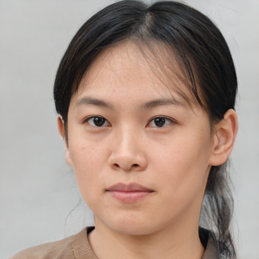 Neutral asian young-adult female with medium  brown hair and brown eyes
