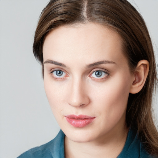 Neutral white young-adult female with long  brown hair and blue eyes