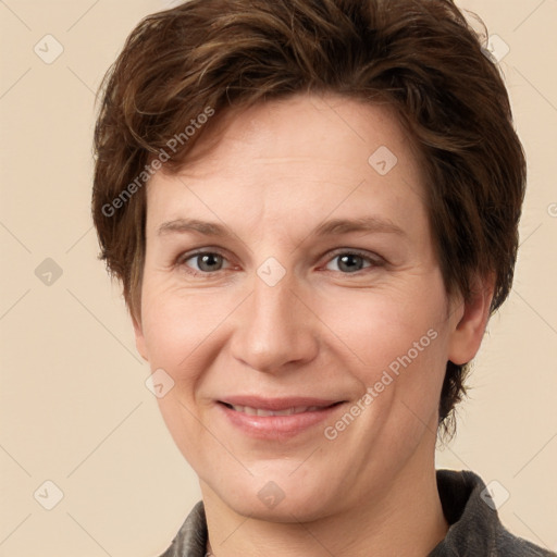 Joyful white adult female with medium  brown hair and grey eyes