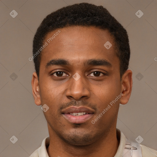 Joyful black young-adult male with short  brown hair and brown eyes