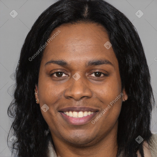 Joyful black young-adult female with long  black hair and brown eyes