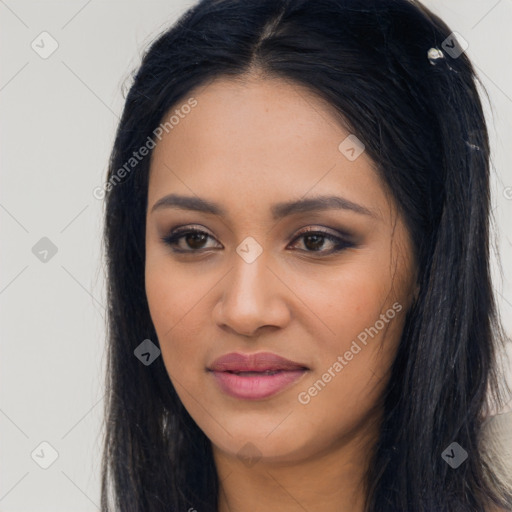 Joyful latino young-adult female with long  black hair and brown eyes