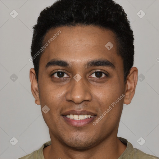 Joyful black young-adult male with short  black hair and brown eyes