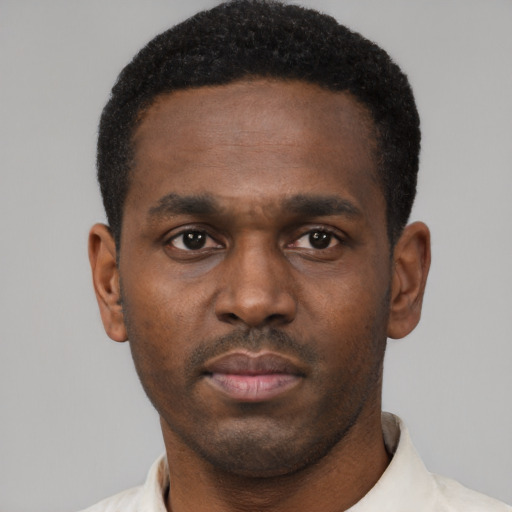 Neutral black young-adult male with short  black hair and brown eyes