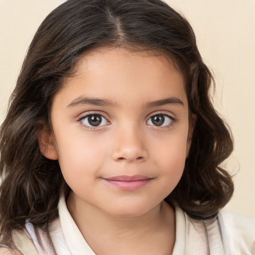 Joyful white child female with medium  brown hair and brown eyes