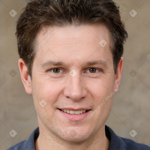 Joyful white adult male with short  brown hair and grey eyes