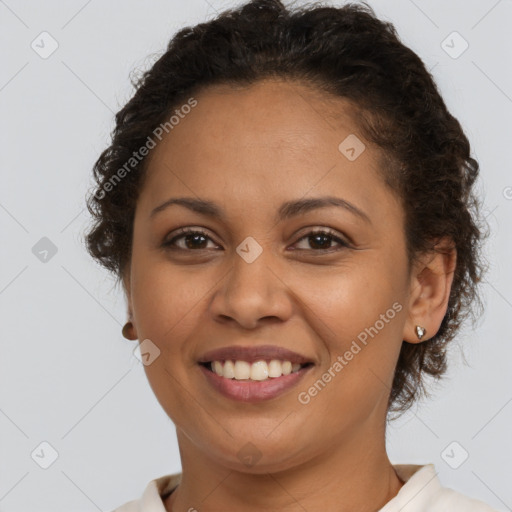 Joyful latino young-adult female with short  brown hair and brown eyes