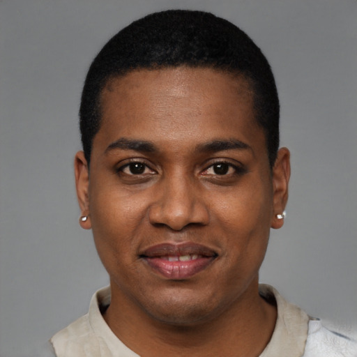 Joyful black young-adult male with short  black hair and brown eyes