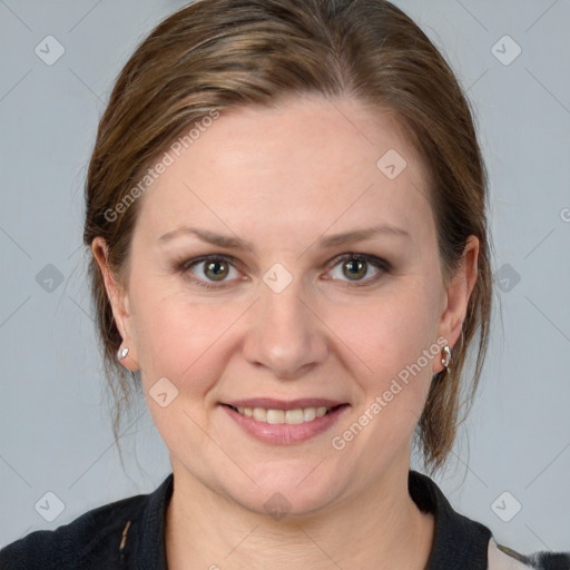 Joyful white adult female with medium  brown hair and blue eyes