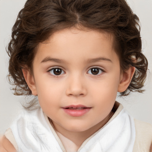 Joyful white child female with medium  brown hair and brown eyes