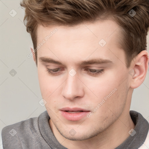 Neutral white young-adult male with short  brown hair and grey eyes