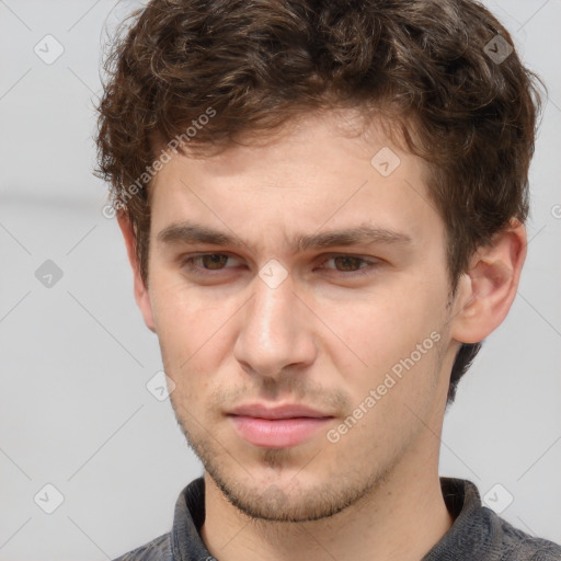 Neutral white young-adult male with short  brown hair and grey eyes