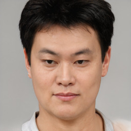 Neutral asian young-adult male with short  brown hair and brown eyes